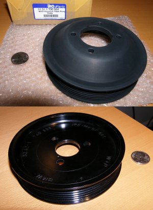 (Image: Closeup of metal water pump pulley and OE plastic power steering pulley)