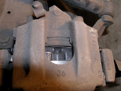 (Image: Brake flush in progress with waste bottle)