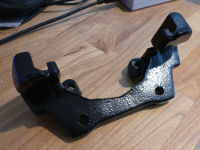 (Image: Closeup of freshly powder coated caliper bracket)