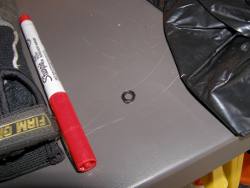 (Image: Closeup of washer-like spare part found during sunroof cassette removal)