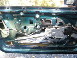 (Image: E36 window regulator installed on door)