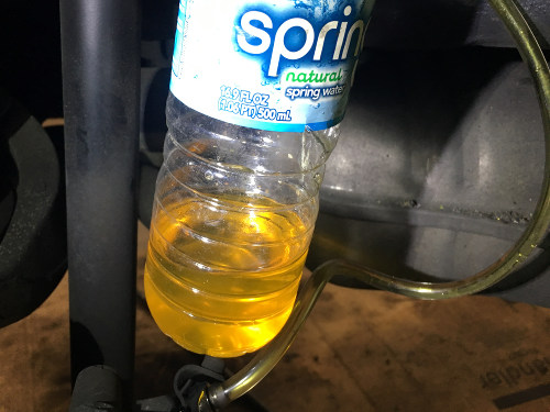 (Image: Old brake fluid flushed from caliper)