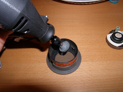 (Image: Using a dremel to modify the tweeter grill housing)