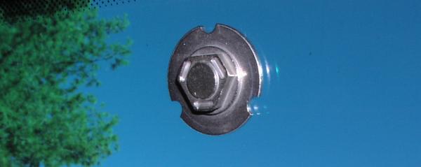 (Image: Closeup of the rear view attachment point on the 
windshield)