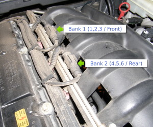 (Image: Location of pre-cat sensor plugs on top of engine)