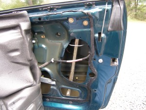 (Image: Vapor barrier removed and door internals exposed)