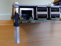 (Image: Closeup of standoff modification near Raspberry Pi)